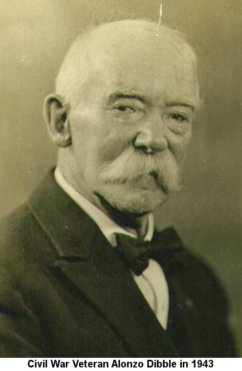 Sepia-tone portrait photograph of an elderly gentleman with a very bushy white moustache, wearing a three-piece suit and a bow tie; caption reads: 'Civil War Veteran Alonzo Dibble in 1943'